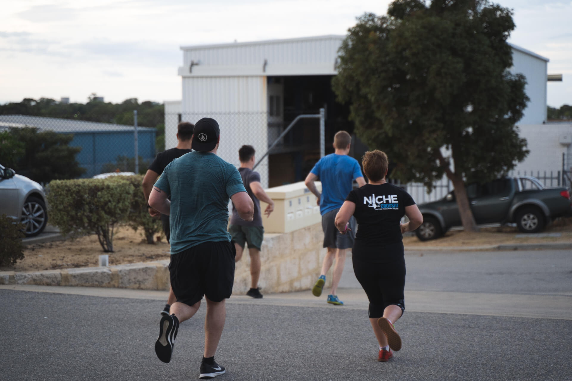 Members running outside the Niche CrossFit facility