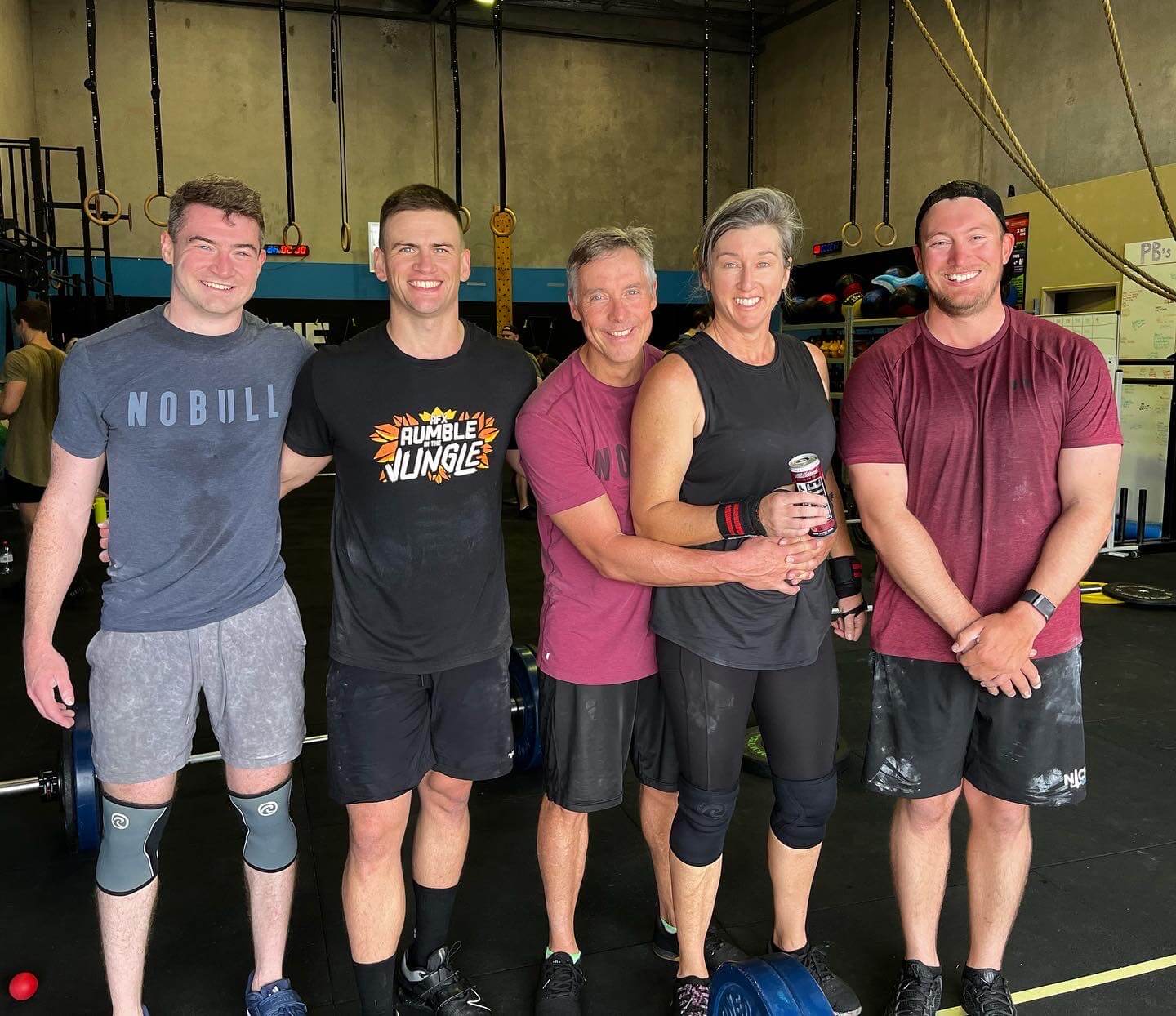 A group of members smiling together after a class