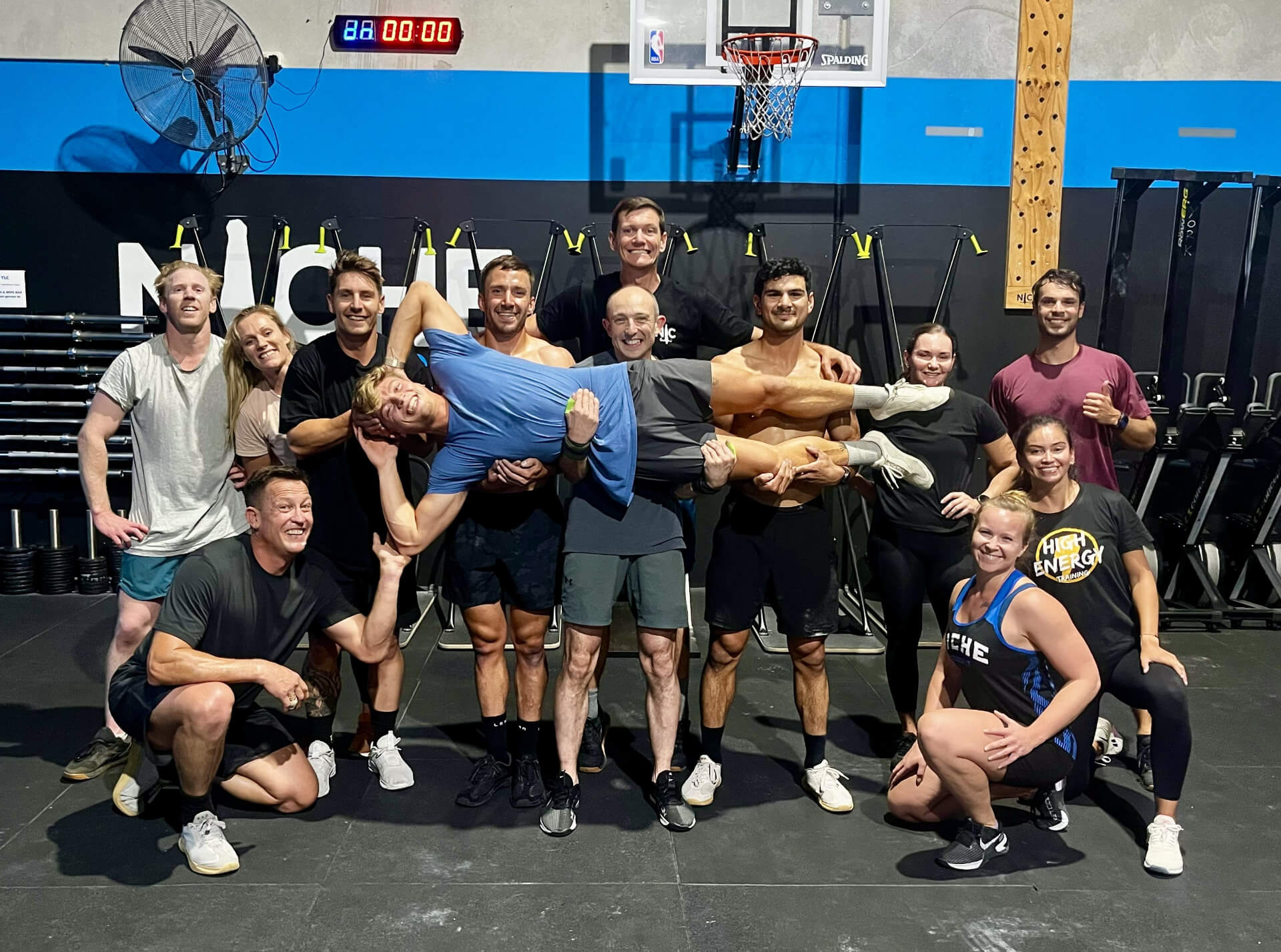 The whole class carrying a member after a workout