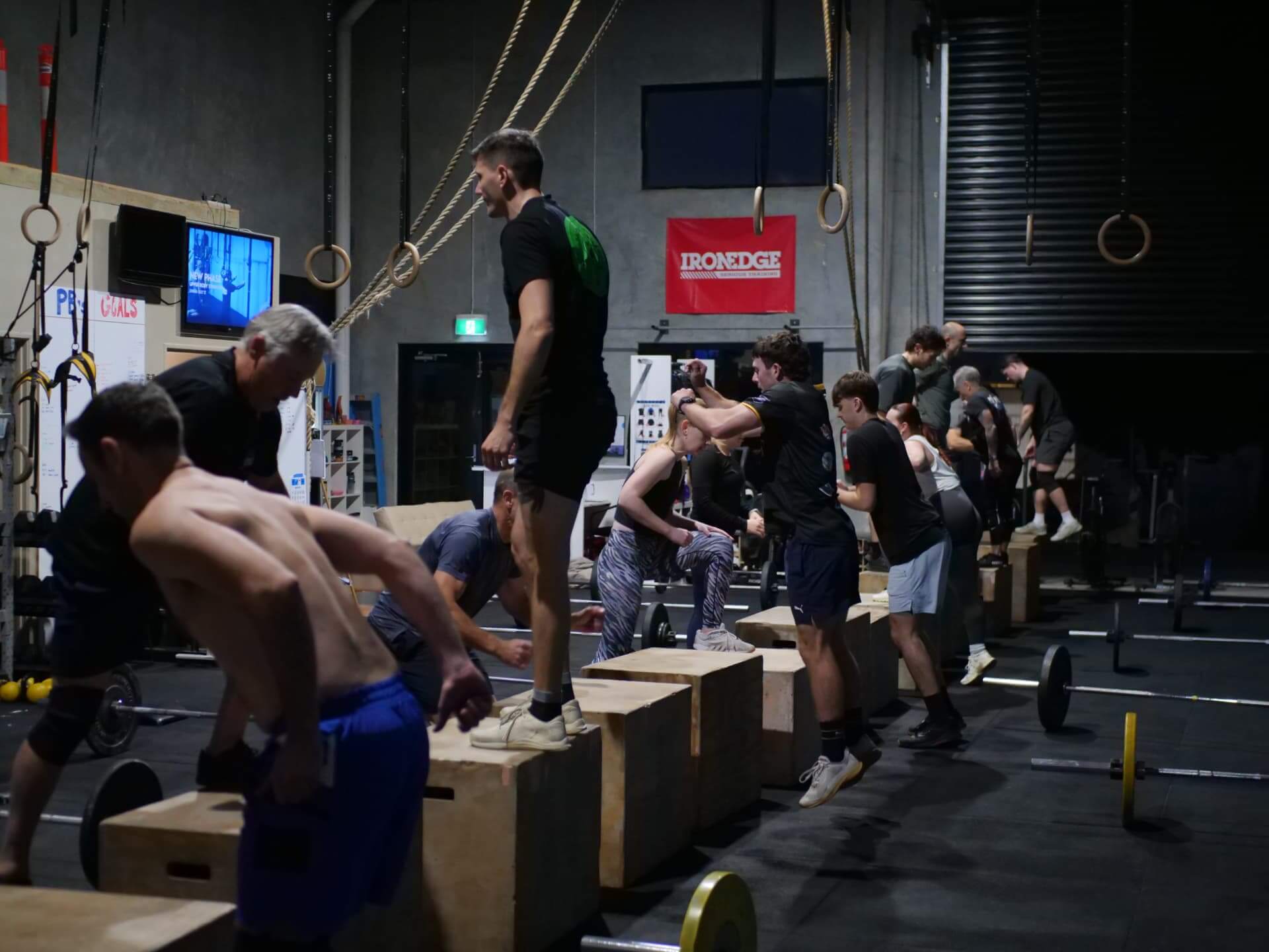 A full class working through box jumps together
