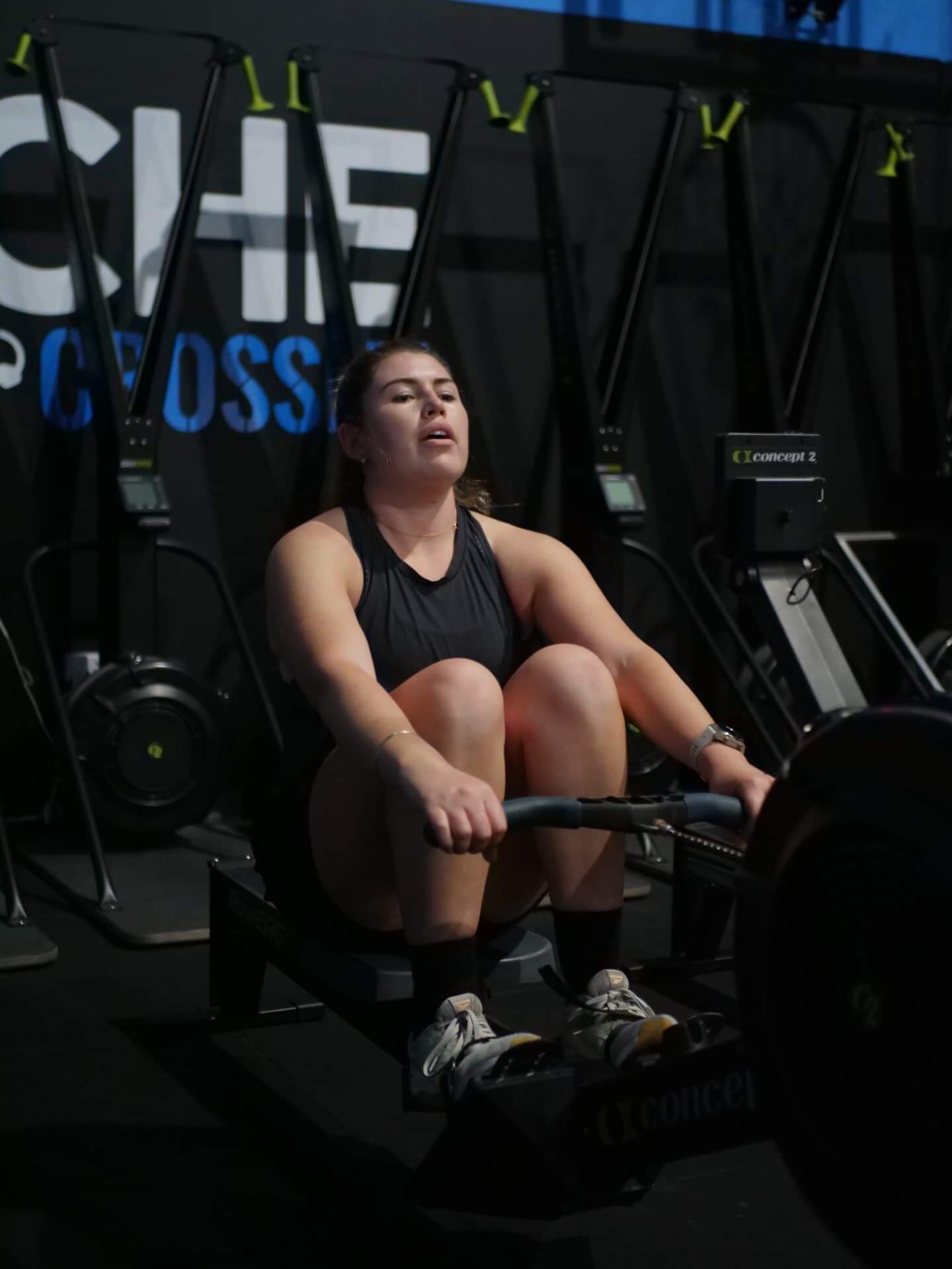 Member pushing through a row under the Niche sign